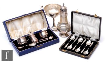 Four assorted hallmarked silver items, a sugar castor, a cased three piece cruet, a cased set of six