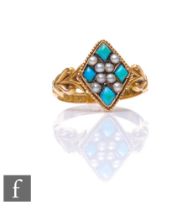 A 15ct hallmarked turquoise and seed pearl marquise shaped cluster ring with knot detail to