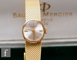 A lady's 18ct Baume & Mercier manual wind wrist watch, gilt batons to a silvered circular dial, case