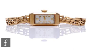 A lady's 9ct hallmarked Avia manual wind wrist watch, gilt batons to a rectangular dial, to a 9ct