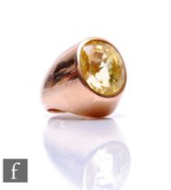 A 9ct single stone yellow beryl ring, oval facet cut collar set stone to a heavy shank, weight 22.