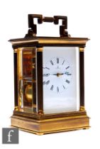 A 20th Century Matthew Norman eight day strike brass carriage clock with Roman numerals to a white