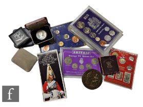 An Elizabeth II 1974 Isle of Man Churchill Centenary crown, other cased sets and single coin sets
