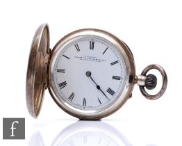 A hallmarked silver full hunter, crown wind pocket watch, Roman numerals to a white enamelled dial