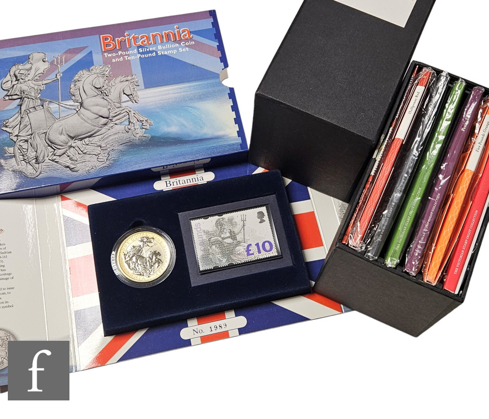 An Elizabeth II Royal Mint Victorian stamp ingot collection, a set of six, and a Britannia silver