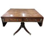 A late Regency period grained rosewood and brass inlaid Sofa Table, with brass mounts and two D