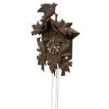 A late 19th Century Swiss oak framed Hanging Cuckoo Clock, with carved bird and leaf decoration,
