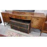 An inlaid and bow fronted mahogany Sideboard, 19th Century with centre mock frieze drawer, flanked