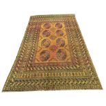 An unusual late 19th Century / early 20th Century Middle Eastern orange ground woollen Carpet, the