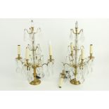 A pair of brass and glass four branch Table Lamps, with lustre drops, 24'' (61cms), (an arm as