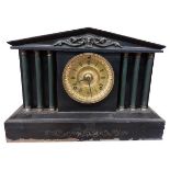 A 19th Century black slate Mantel Clock, the arched top with ornate frieze, the circular brass
