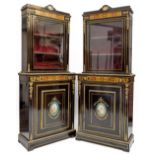 A pair of ebonised boulle inlaid and brass mounted Display Cabinets, late 19th Century, the pediment