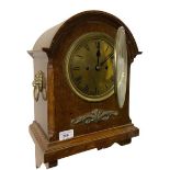 An Edwardian oak framed dome top Bracket Clock, with brass dial and Roman numerals, ormolu mount and