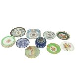 A set of 6 hand coloured floral Dessert Plates, 8 1/2'' (22cms); four other hand coloured Plates, a