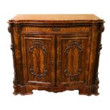 A fine quality Victorian figured mahogany serpentine shaped Drinks Cabinet, with moulded top over