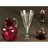 A Bohemian ruby glass and vine engraved Perfume Bottle and stopper, (as is), a cranberry glass Jug
