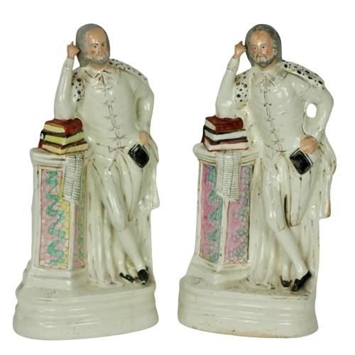 A good tall pair of large Staffordshire Figures of Shakespeare, standing by a pilaster with elbow