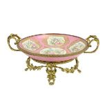 A very attractiveÿ pink ground floral decorated Serves style porcelain Dish, on ornate rococo