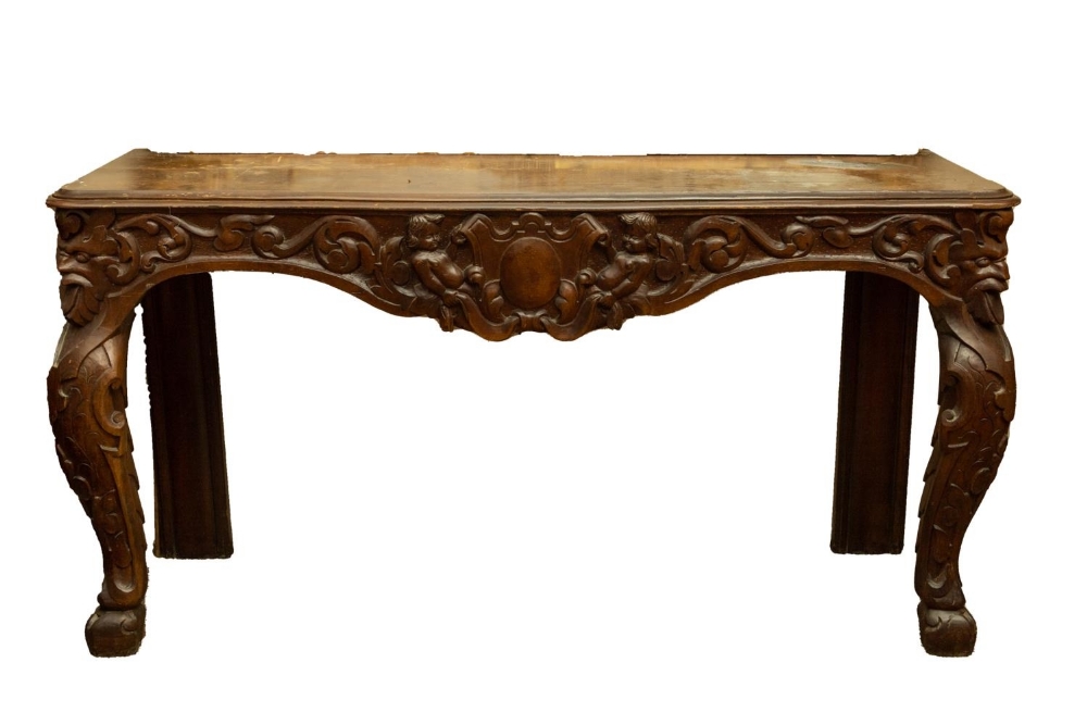 A 19th Century Provincial carved pine Side or Console Table, the rectangular moulded top above an