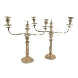 A fine early pair of Sheffield silver plated two branch Candelabra, each with scrolling arms and urn