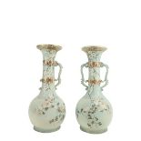 A pair of Japanese two handled Satsuma Vases, (one lacking a handle) each with a long neck with