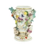 A 19th Century porcelain Meissen Vase, the floral encrusted design with cherubs and fruit, approx.