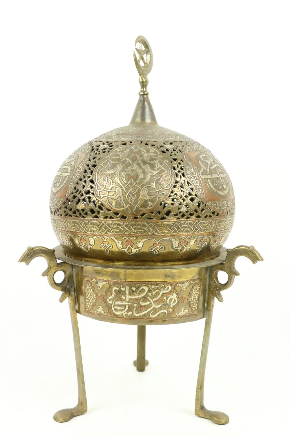 A late 19th Century Islamic brass, copper and silver Incense Burner, with pierced dome cover with