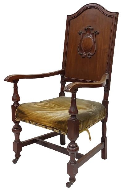 A mahogany Armchair or Hall Chair, the arched and moulded back centred with a carved cartouche above