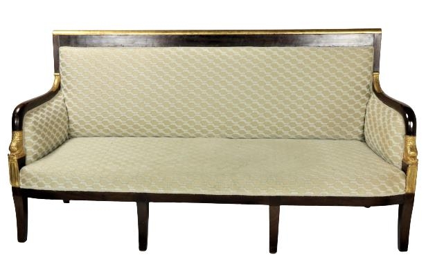 A good 19th Century mahogany and parcel gilt Settee, the cream upholstered back with straight gilded