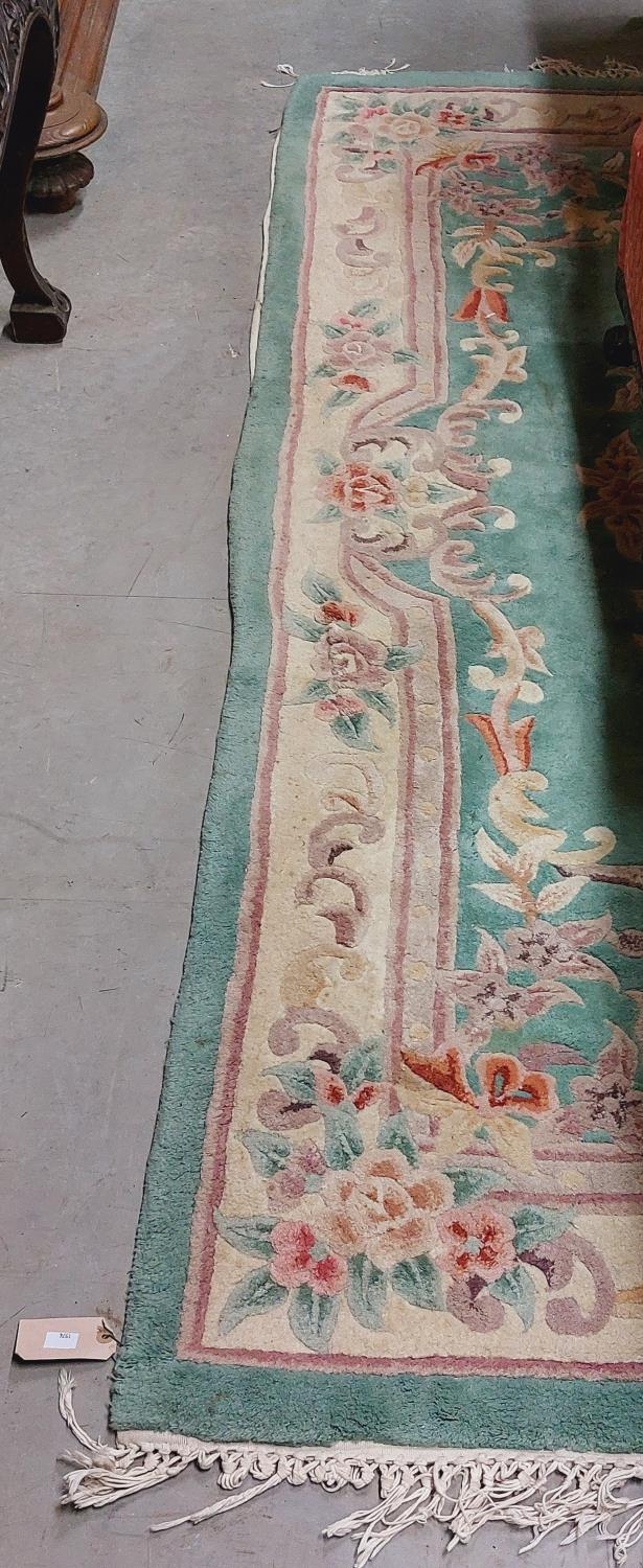 An attractive heavy woollen Chinese green ground floral decorated Carpet, approx. 253cms x 172cms ( - Image 2 of 3