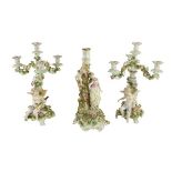 An attractive pair of Sitzendorf porcelainÿCandelabra, each with three flower encrusted arms and a