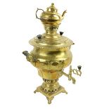 A 19th Century brass Samovar, with original teapot, shaped and turned handles on platform base