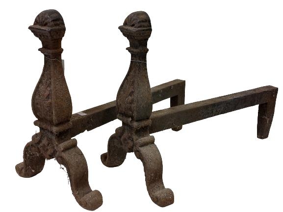 A pair of very heavy cast iron Andirons, each with scroll cast front on cast arched scroll legs with