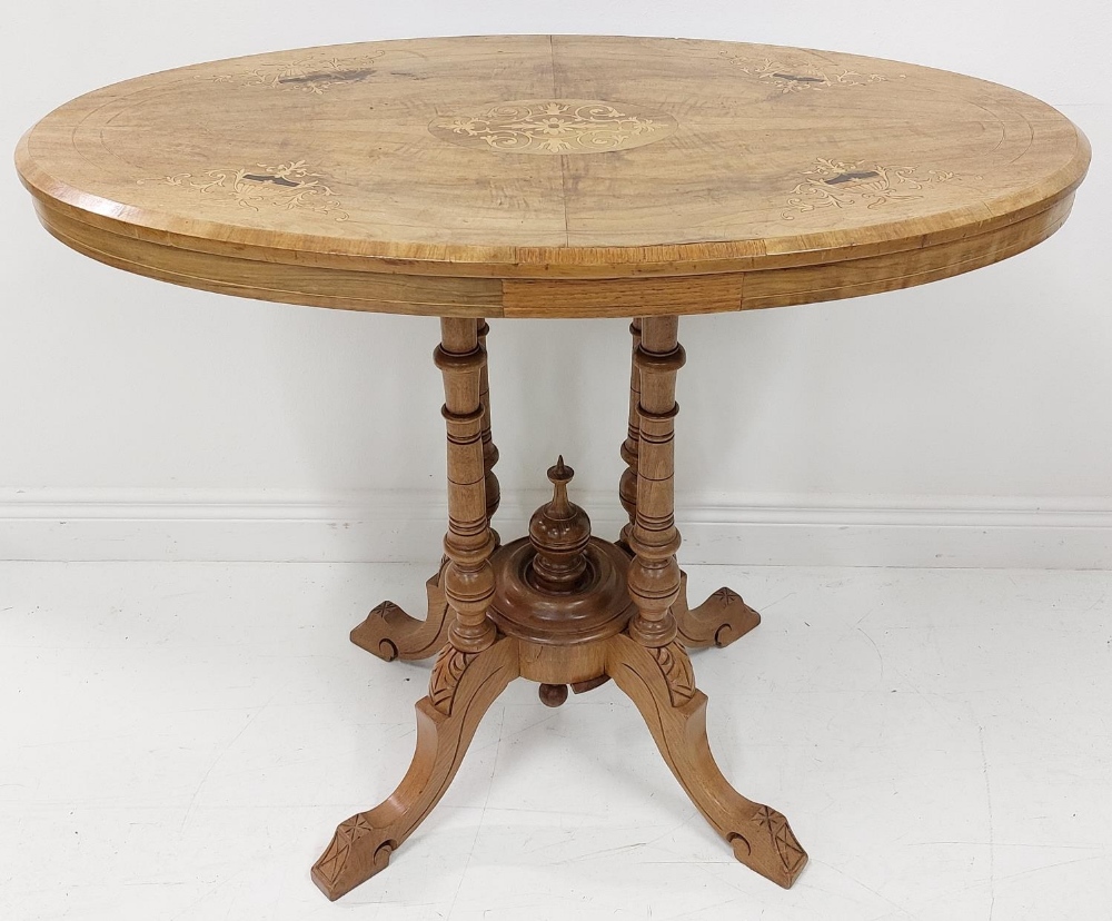 A small oval Victorian walnut and marquetry Loo Table, on four turned stems and quadruple pod, - Image 2 of 3