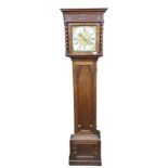 An oak Longcase Clock, in the 19th Century style, with moulded cornice above a carved frieze and a