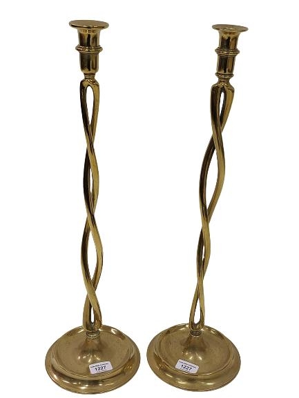 A pair of early and unusual twisted Candlesticks, on bowl shaped circular bases, approx. 59cms (