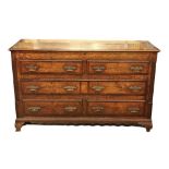 A good late 18th Century oak and mahogany banded Mule Chest, with hinged top above one long and