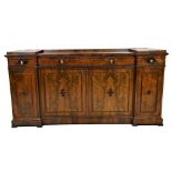 A fine quality mid-19th Century flamed mahogany inverted Sideboard, the shaped top with inset