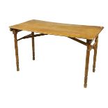 A 20th Century pine folding Campaign Table, on four turned legs, 43'' x 23'' (109cms x 58cms). (1)