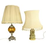 An embossed brass Table Lamp, the two stage body with classical figures in relief supporting an