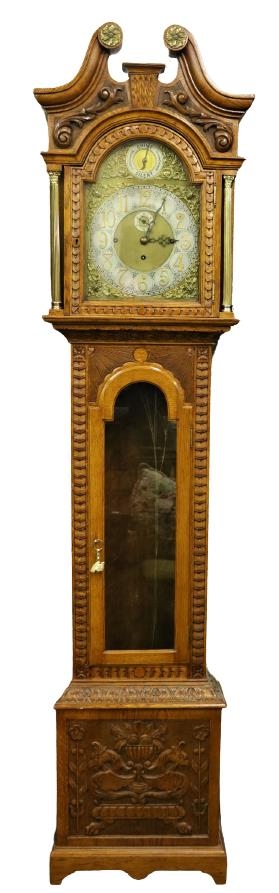 A 19th Century oak framed Grandfather Clock, the swan neck pediment with circular ormolu mounts over