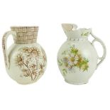 A large Belleek pottery Jug, (damaged); and one other Jug (2)