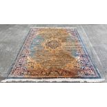 An antique style Middle Eastern silk Carpet, with large central fawn ground medallion decorated