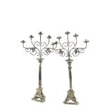 A pair of tall four branch silver plated Altar Candelabra, with scrolling arms and reeded stems on