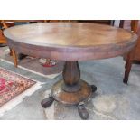 A 19th Century rosewood and mahogany segmented circular Hall Table, the shaped support on circular