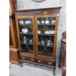 A Chippendale style mahogany Display Cabinet, on associated stand with dentil moulded cornice