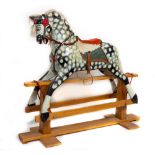 An attractive carved and hand painted Rocking Horse, with horse hair mane and tail on a pine