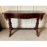 A Victorian serpentine fronted Dressing Table, with frieze drawer on turned supports united with