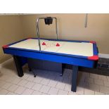 An electric operated Air Hockey Table, with electric scoreboard and paddles, approx. 216cms long x