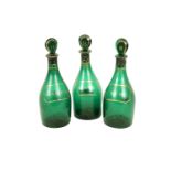 A set of three - 19th Century Bristol green Decanter Bottles and lids, with gilt highlight and
